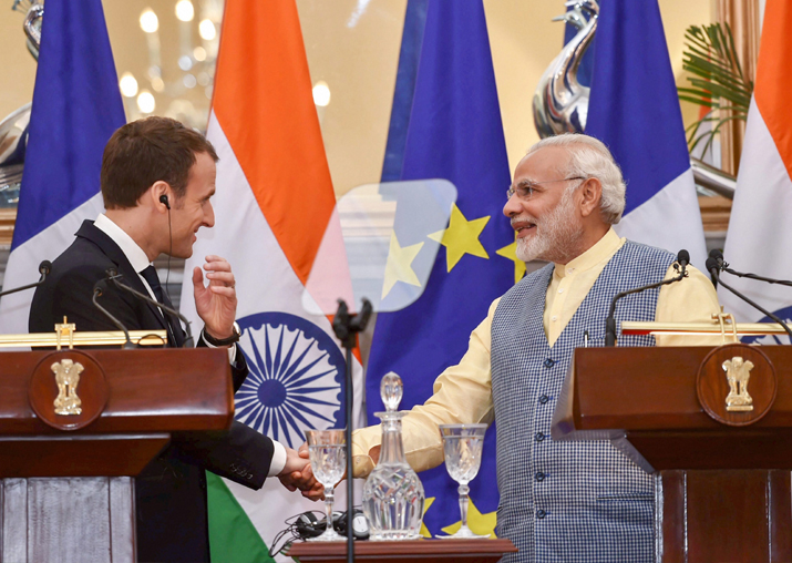 India Tv - Prime Minister Narendra Modi shakes hands with French President Emmanuel Macron during their joint press conference at Hyderabad House, in New Delhi on Saturday.