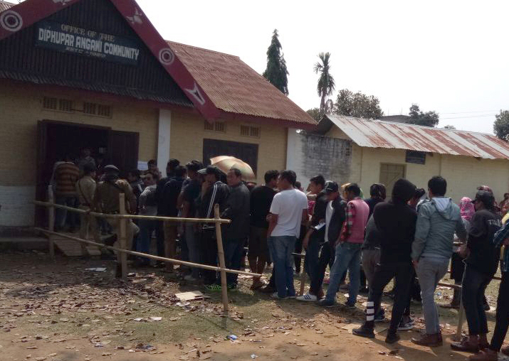 People wait in queues to cast their vote during Nagaland