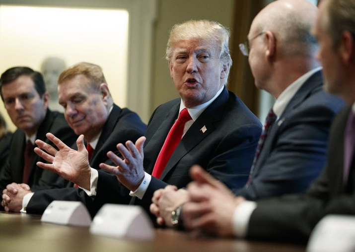 President Donald Trump speaks during a meeting with steel