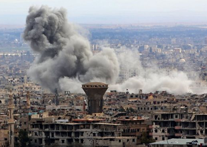 Smoke rises from the besieged rebel-held Eastern Ghouta,