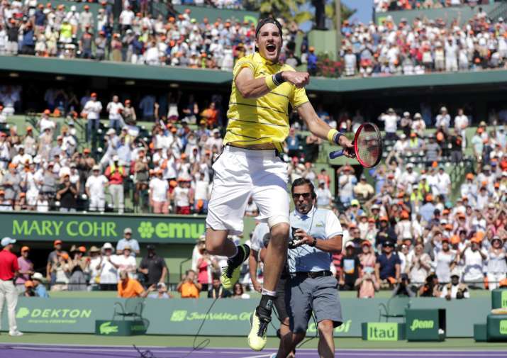 India Tv - Isner jumps with glee after winning the finals