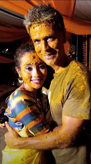 India Tv - Milind Soman and Ankita Konwar in each other's embrace at their Haldi ceremony. 