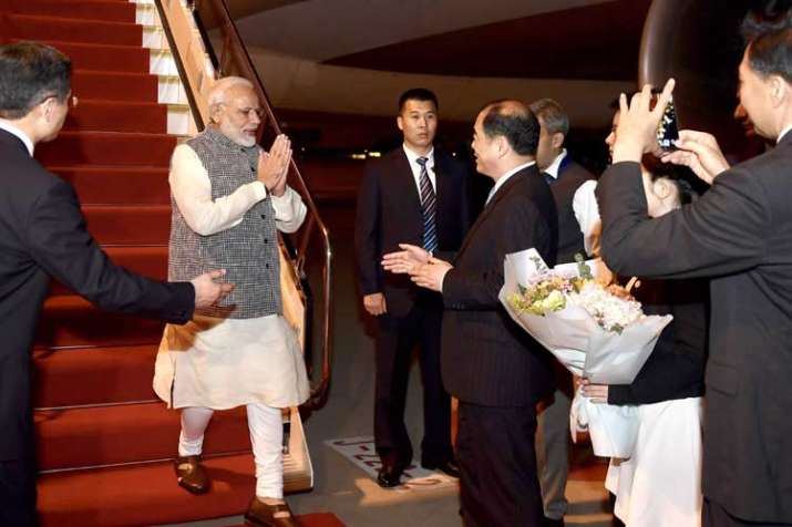 PM Narendra Modi is greeted by Chinese officials as he