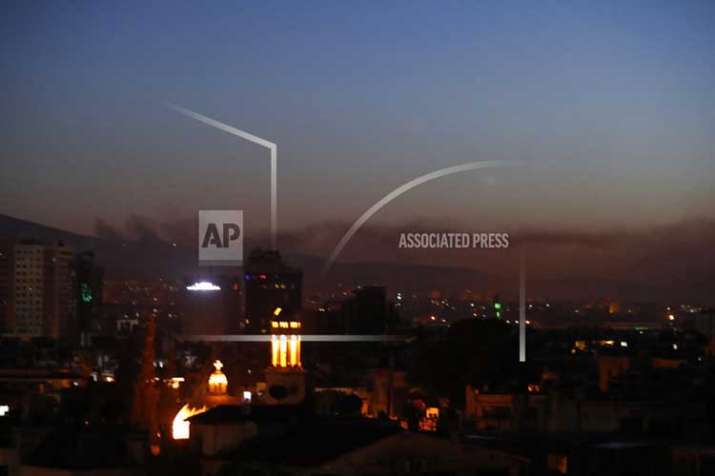 Smoke rises after airstrikes targeting different parts of