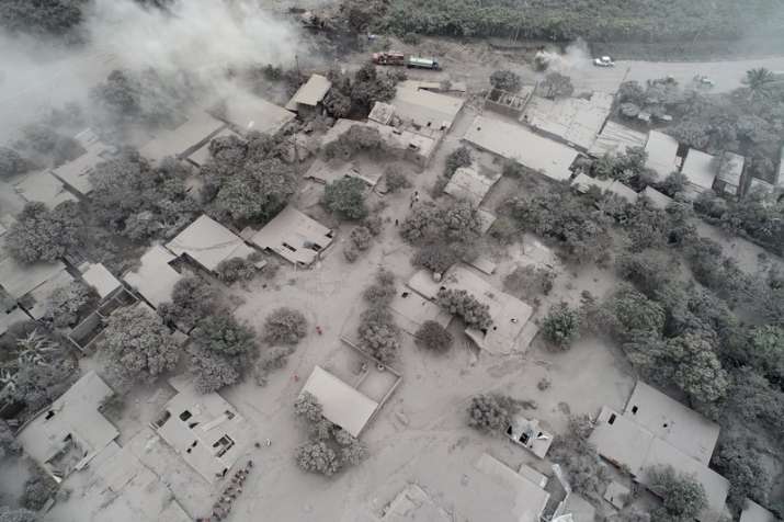 Rescue workers search in El Rodeo, one of the hamlets in