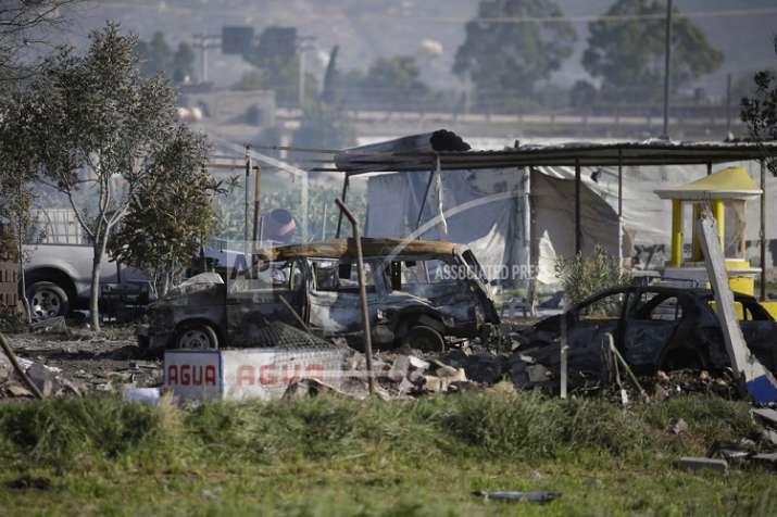 Wrecked buildings and scorched ground covered a rural patch