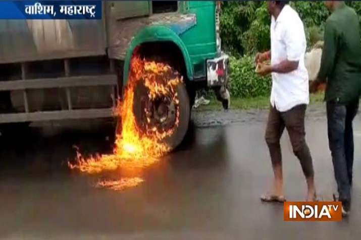 Swabhimani Shetkari Sanghatana activists pour milk at the