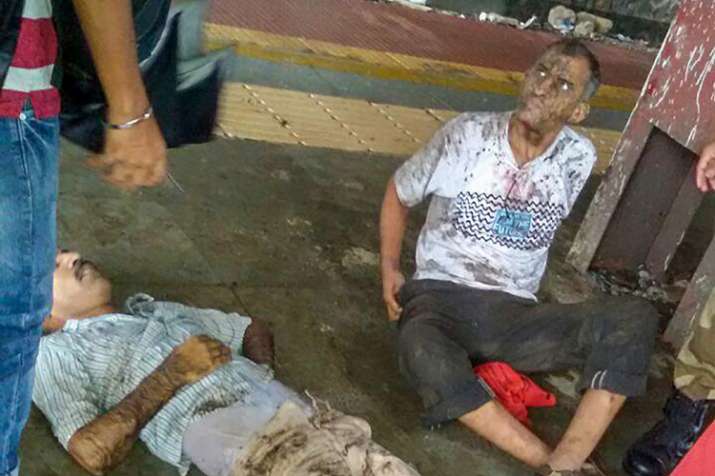 India Tv - Two of the injured men pulled out of overbridge rubble. (Photo/PTI)