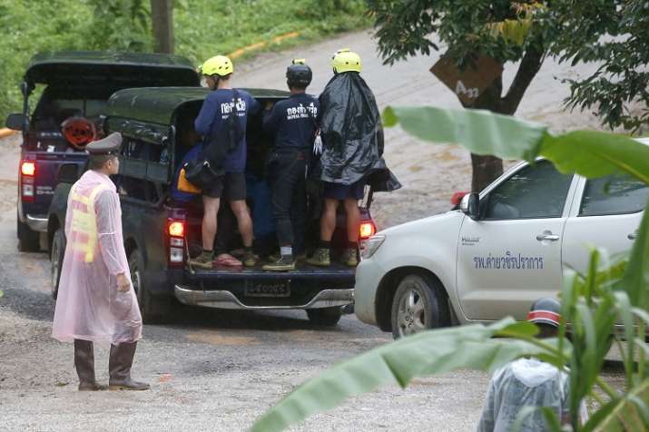 India Tv -  Rescuers move to the entrance to a cave complex where five stil lwere trapped in Mae Sai, Chiang Rai province, northern Thailand on Tuesday.