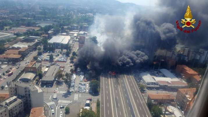 India Tv - In this photo released by the Italian firefighters, an helicopter view of the explosion on a highway in the outskirts of Bologna, Italy, Monday, Aug 6, 2018. 