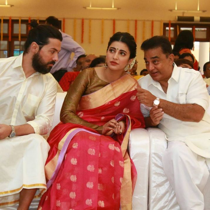 India Tv - Shruti Haasan and Michael Corsale with Kamal Haasan at a wedding in Chennai. 