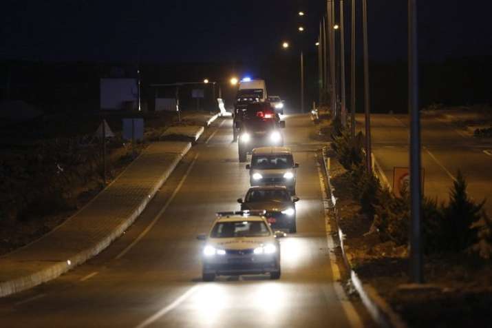 A convoy with US pastor sitting inside a car arrives for