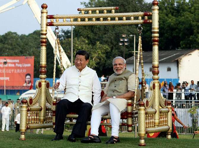 India Tv - Prime Minister Narendra Modi and Chinese President Xi Jinping on a jhoola at the Sabarmati waterfront in September, 2014