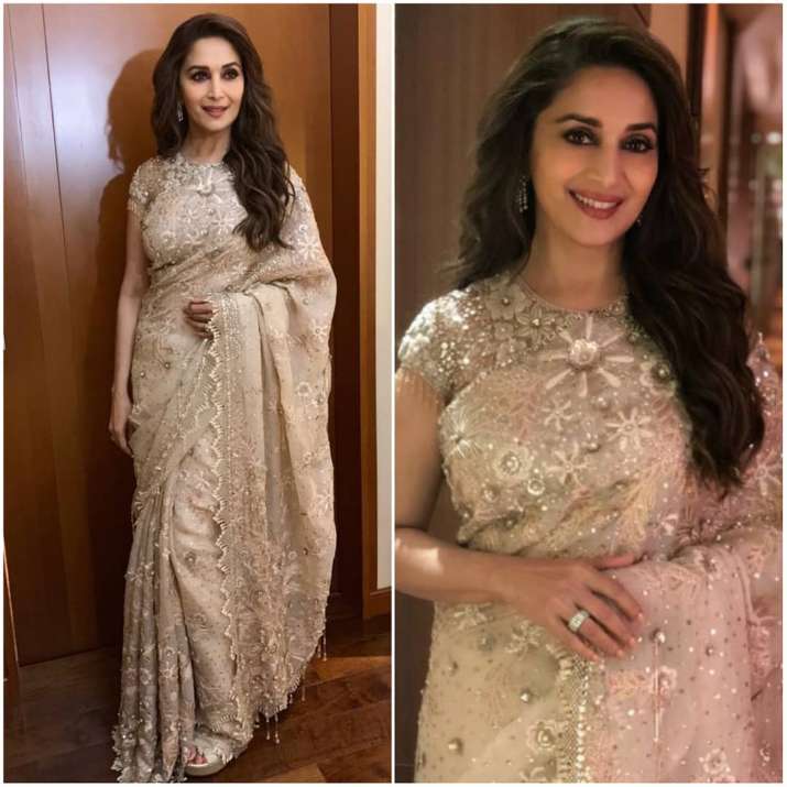 India Tv - Madhuri Dixit looks heavenly in white