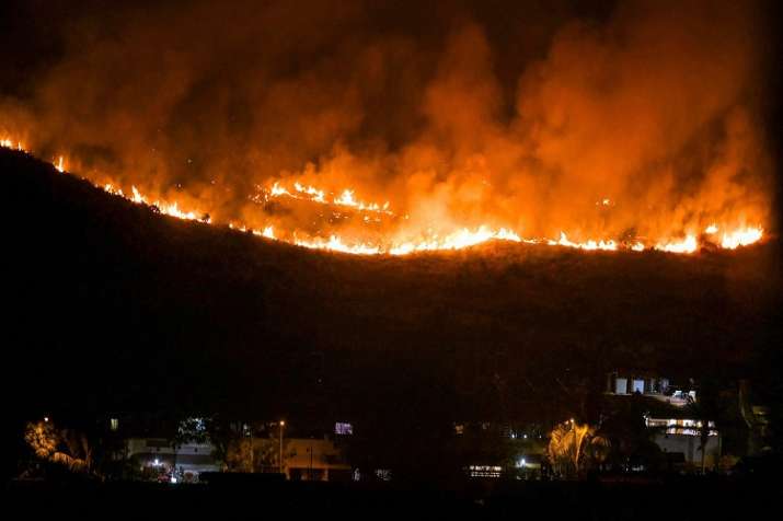 The blaze was noticed on one of the forested hills in