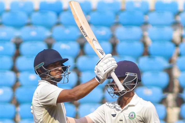 Vidarbha batsman Ganesh Satish celebrates his half-century against Rest of India during Irani Cup
