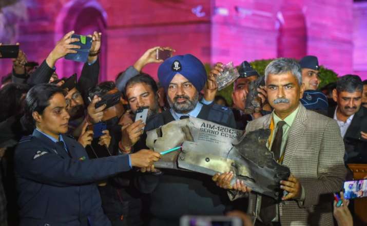 Indian Air Force officials show sections of an exploded