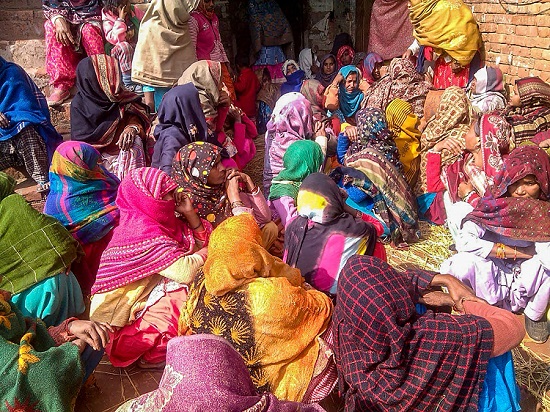 Family members mourn the death of victims who were poisoned