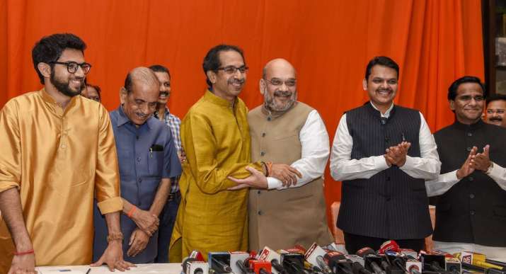 BJP President Amit Shah hugs Shiv Sena President Uddhav