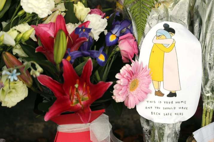 India Tv - A message card is placed at a collection of flowers left at the Botanical Gardens in Christchurch, New Zealand, Saturday, March 16, 2019. 