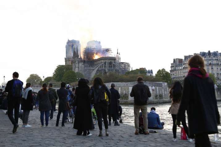 Flames and smoke rise from Notre Dame cathedral as it