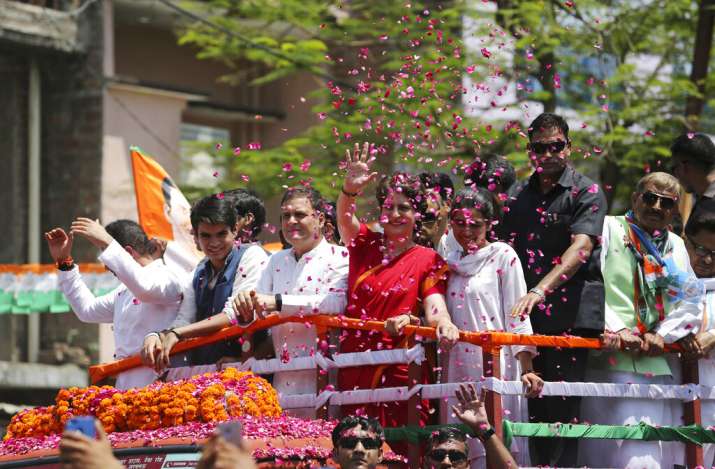 India Tv - People throw petals as Congress party chief Rahul Gandhi accompanied by his sister Priyanka Vadra arrives to file his nomination papers for the upcoming general elections in Amethi, Uttar Pradesh state, India, Wednesday, April 10, 2019.