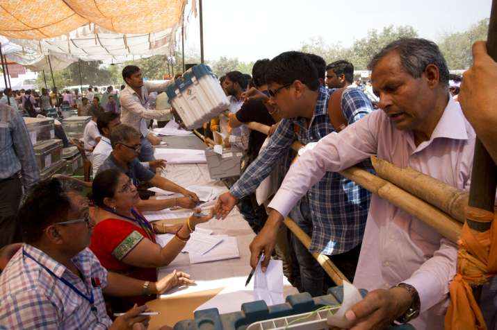 India Tv - Polling officers collect election materials for the first phase of general elections, in Ghaziabad, outskirts of New Delhi, India, Wednesday, April 10, 2019. Voting will take place in seven phases over six weeks beginning Thursday.