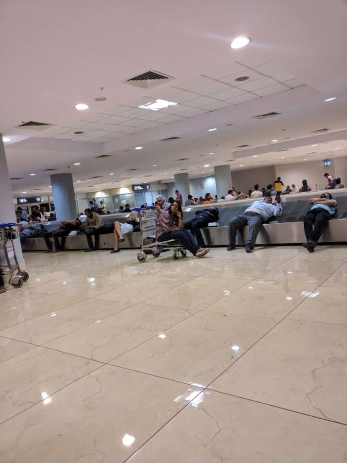 India Tv - People waiting in the airport as their flight from Kolkata to Mumbai had to land at Nagpur airport due to Mumbai Rains.