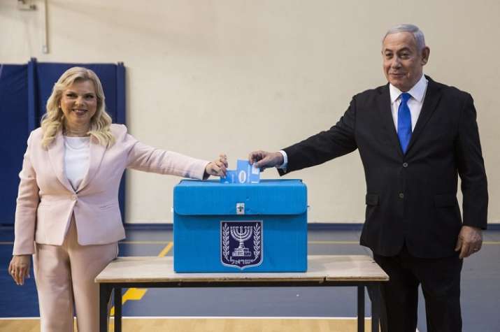 India Tv - Israeli Prime Minister Benjamin and his wife Sarah casts their votes at a voting station in Jerusalem 