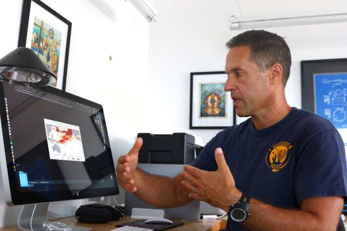 India Tv - Greg Asner, the director of Arizona State University's Center for Global Discovery and Conservation Science, reviews ocean temperature data at his lab on the west coast of the Big Island near Captain Cook, Hawaii. 