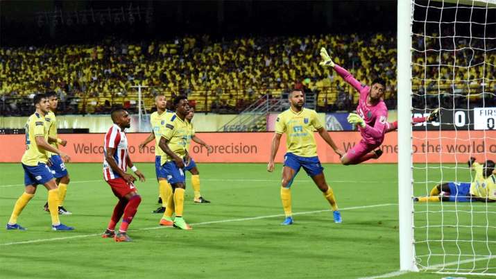 ATK team players score a goal during their match against