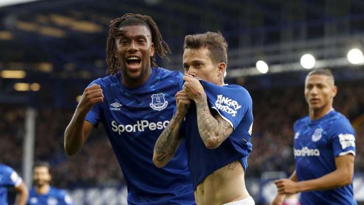Everton's Bernard, centre, celebrates scoring his side's