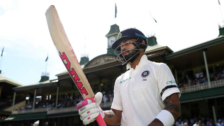 Virat Kohli of India walks out to bat during day one of the