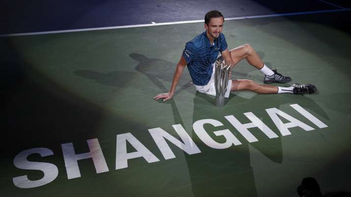 Daniil Medvedev of Russia poses with his winner's trophy on