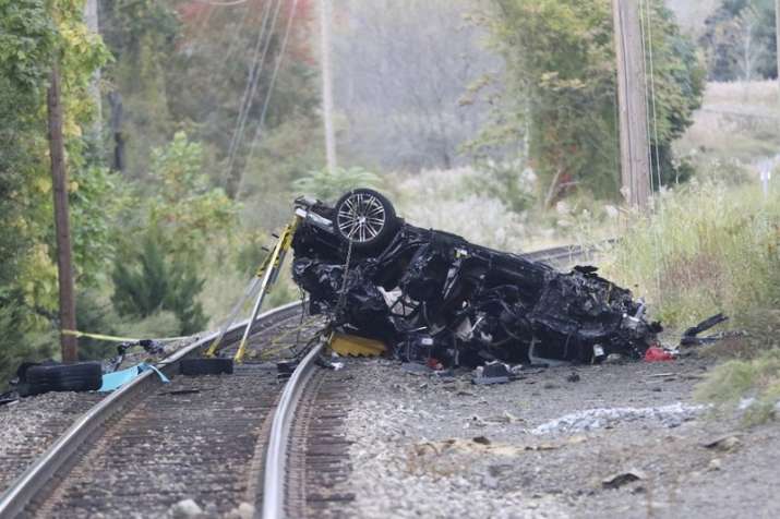 Porsche SUV plunges onto train tracks, burst into flames; 2