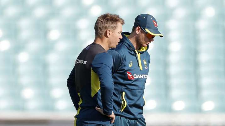 David Warner and Steve Smith of Australia inspect the pitch