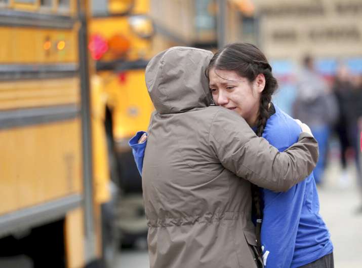 Student, officer injured in high school shooting in