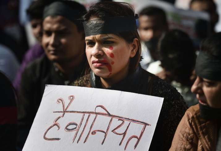 Protester wearing black band against rape and brutal murder