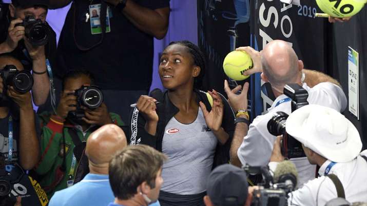United States' Cori "Coco" Gauff signs autographs after