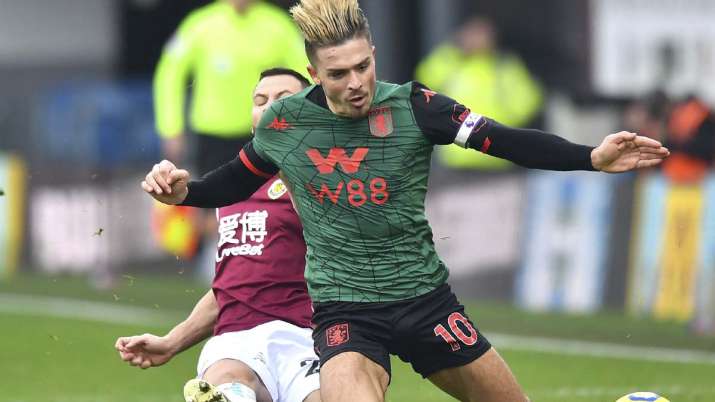 Burnley's Phil Bardsley, background tackles Aston Villa's