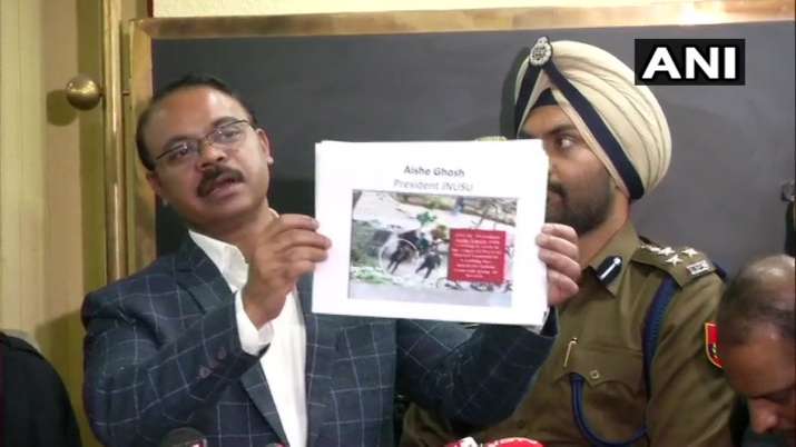 Delhi Police's DCP (Crime) Joy Tirkey holds up what he