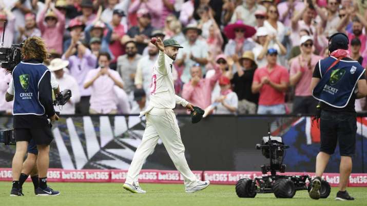 Australia's Nathan Lyon leaves the field after taking 5