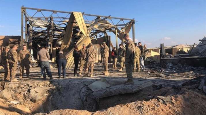 US soldiers stand at the site of Ain al-Asad air base in