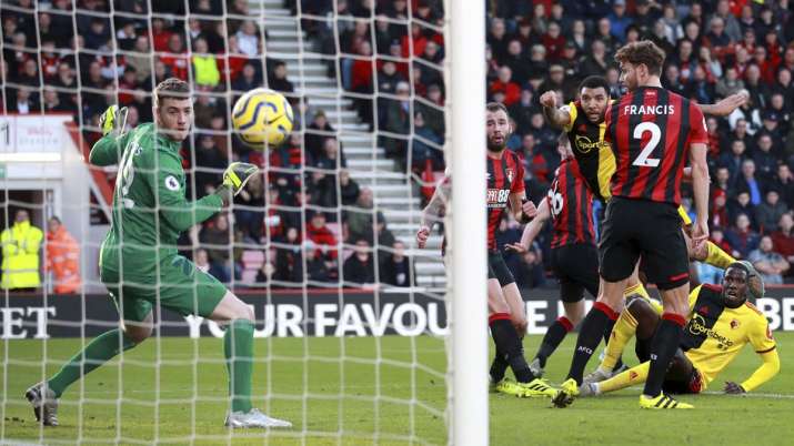 Watford's Troy Deeney, centre right, scores his side's