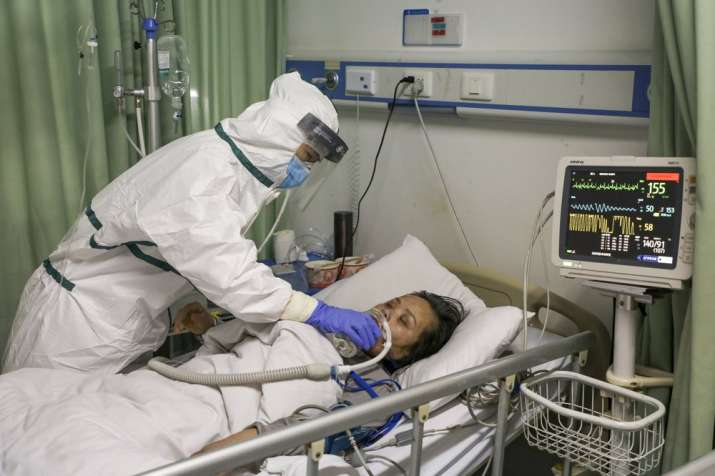 India Tv - In this Thursday, Feb. 6, 2020, photo, a nurse feeds water to a patient in the isolation ward for 20