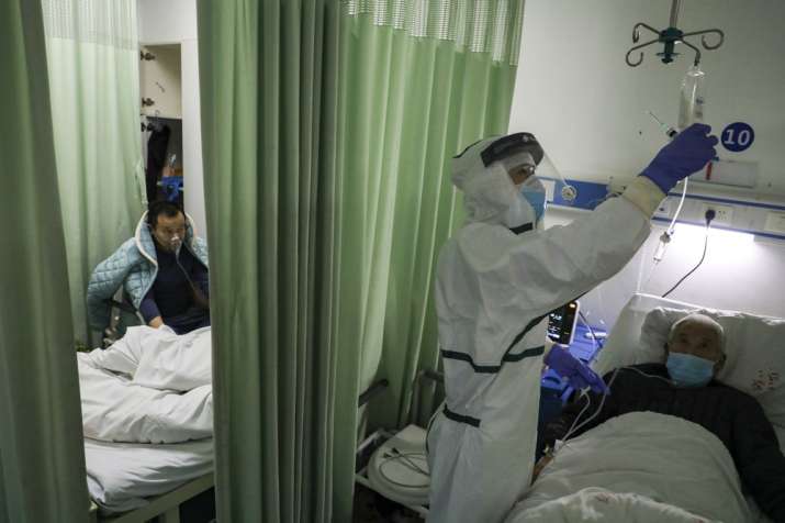 India Tv - In this Thursday, Feb. 6, 2020, photo, a nurse checks on a patient in the isolation ward for 2019-nC