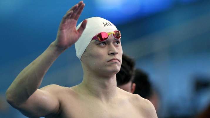 China's Sun Yang waves following the men's 4x200m