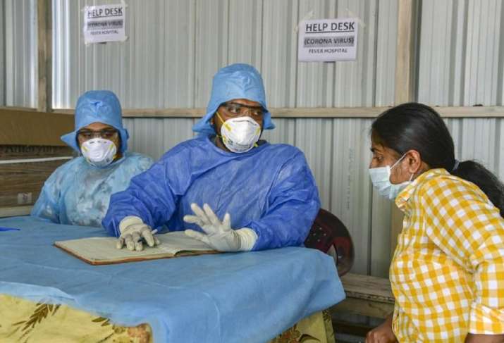 Doctors wearing facemask while examining cases of