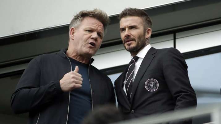 David Beckham, right, talks to chef Gordon Ramsay before an