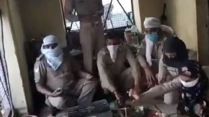 Police officials in Pilibhit cooking food, as part of the